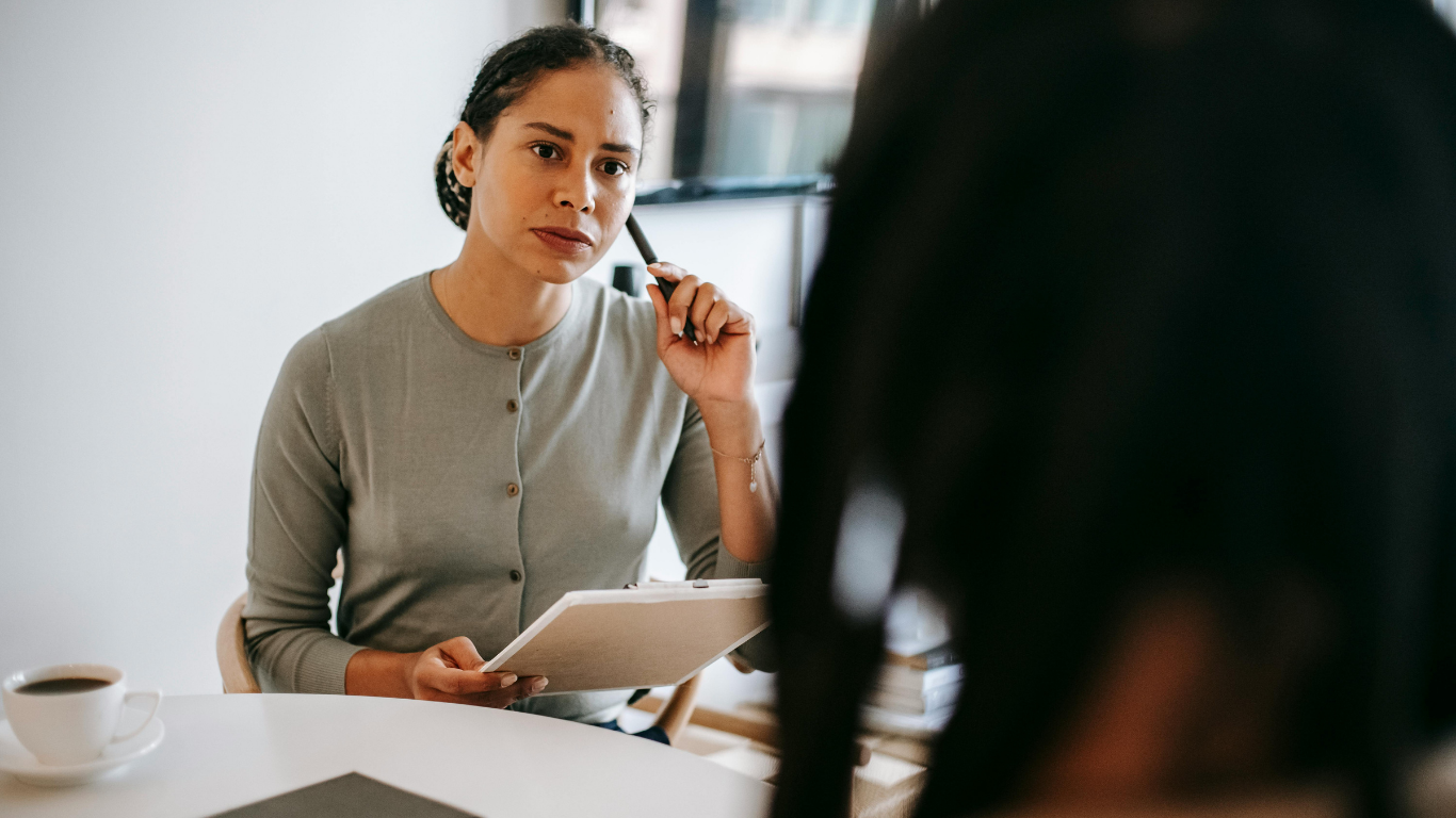 Clinician conducting a psychological assessment interview