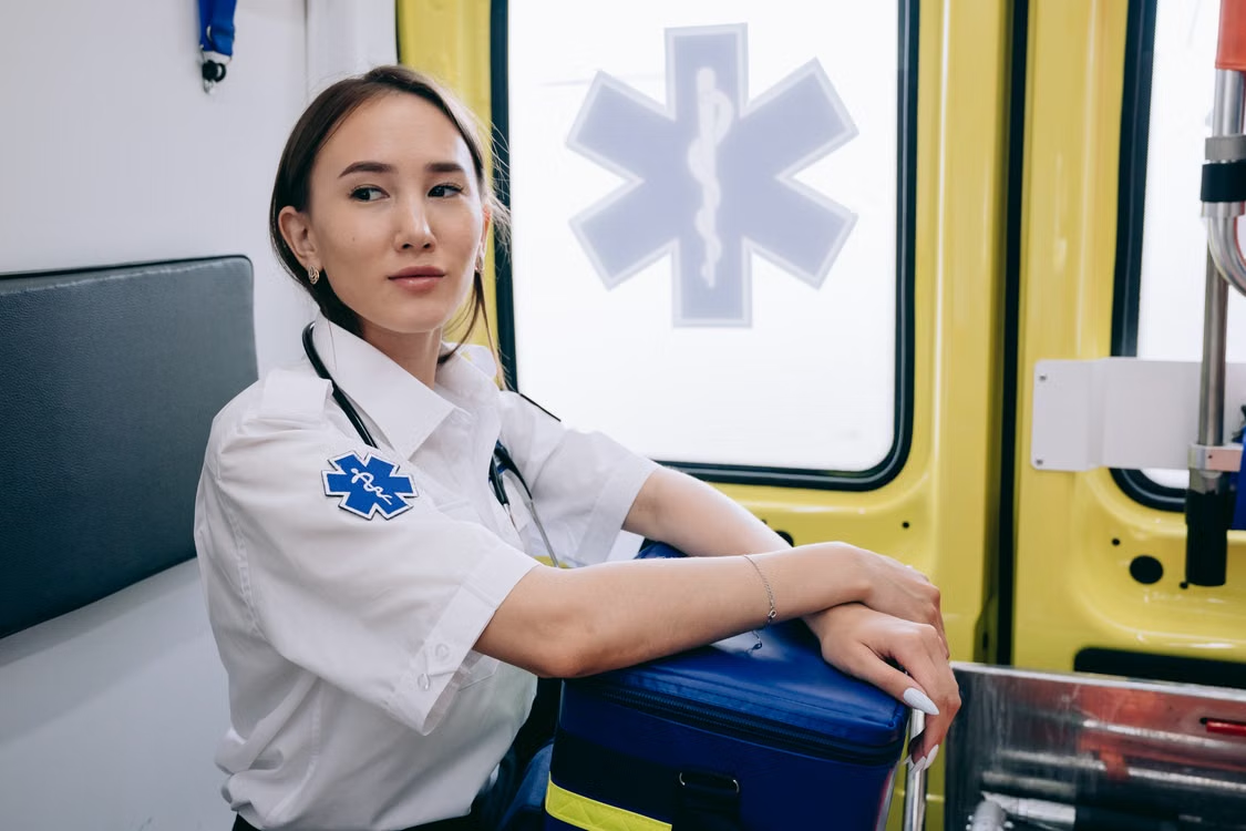 Paramedic in ambulance, trauma-informed care for first responders