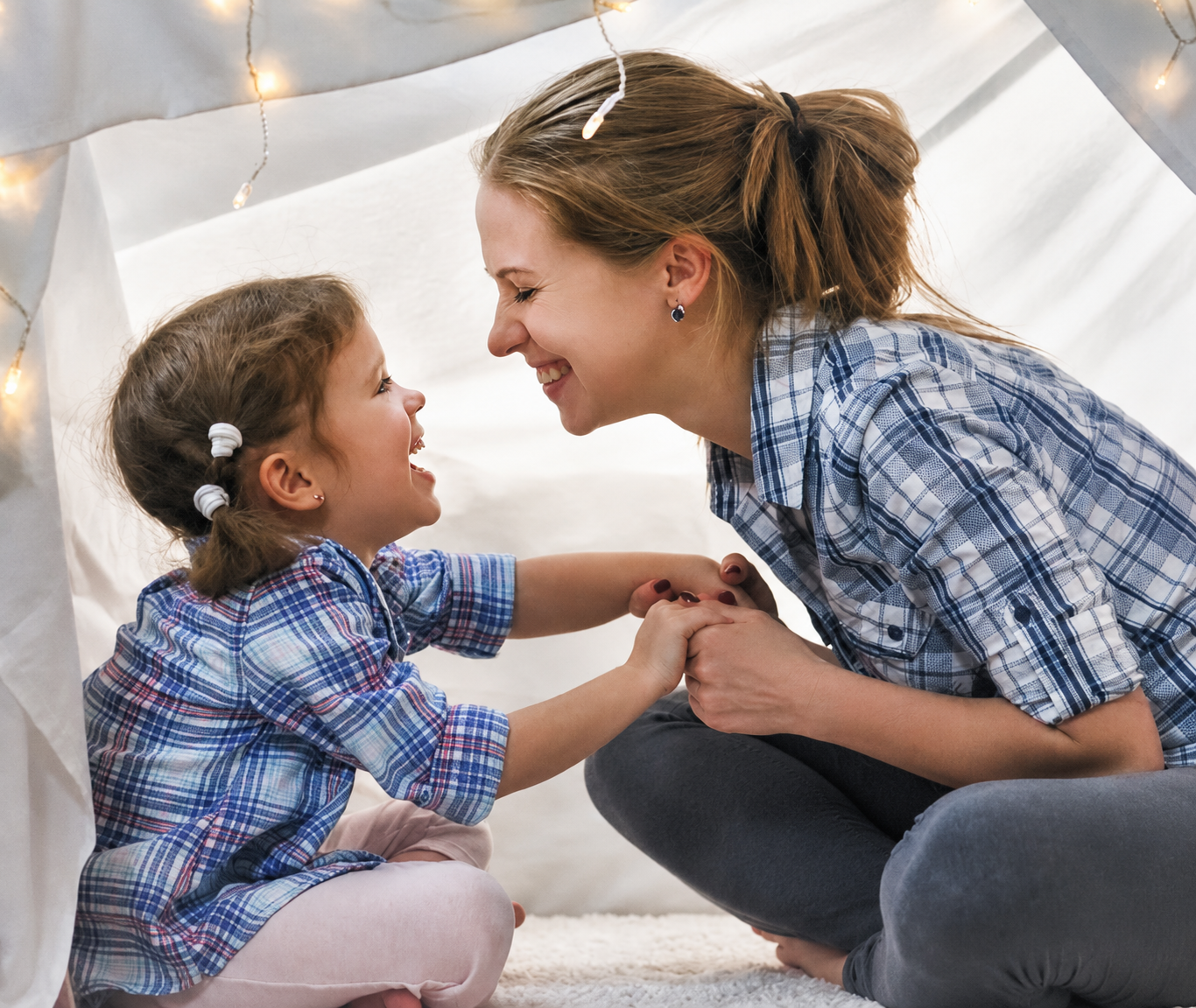 A mother and child sharing a warm, joyful moment together